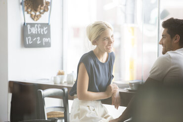 Couple talking in cafe - CAIF15198