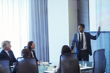 Businessman giving presentation to colleagues in conference room - CAIF15252