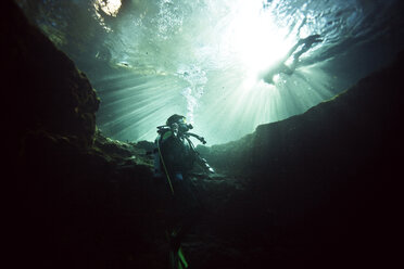 Low angle view of divers in sea - CAVF06511