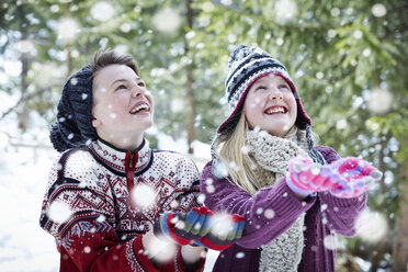 Siblings catching snow together - CAIF15382