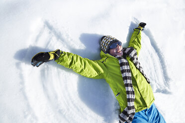 Man making snow angle - CAIF15383