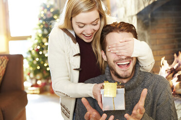 Couple exchanging gifts on Christmas - CAIF15391