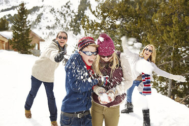 Family having snowball fight together - CAIF15394