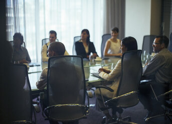 Business people attending meeting in conference room - CAIF15426