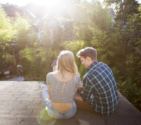 Couple sitting on roof - CAVF07076