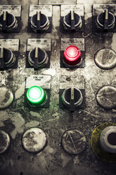 Close-up of buttons on messy control panel at metal industry - CAVF07390
