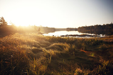 Scenic view of lake during sunset - CAVF07417