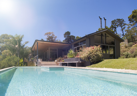 House exterior with large swimming pool stock photo