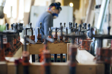 Side view of male carpenter in workshop - CAVF07467