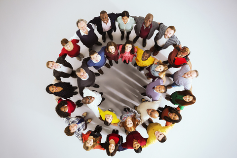Portrait of confident business people in circle stock photo