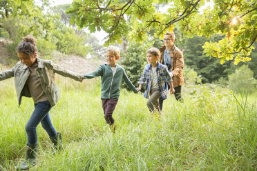 Students and teacher walking outdoors - CAIF16240