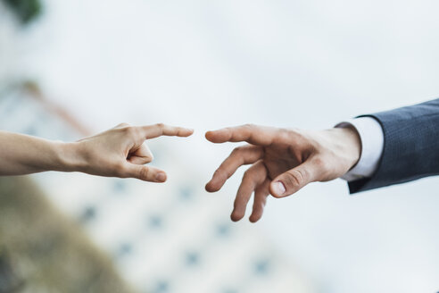 Hands of man and woman about to touch - JSCF00071