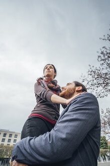 Low angle view of woman above businessman - JSCF00080