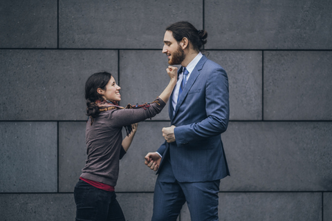 Businessman and woman fighting stock photo