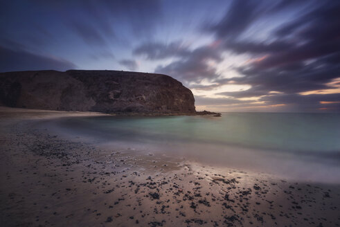 Spain, Canary Islands, Lanzarote, Papagayo beach at dusk - DHCF00181