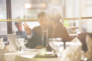 Business people talking in restaurant - CAIF16325