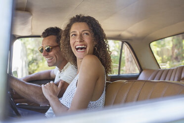 Couple laughing during car ride - CAIF16722