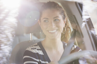 Happy woman driving car - CAIF16907