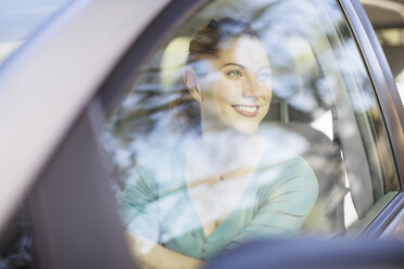 Happy woman driving car - CAIF16912