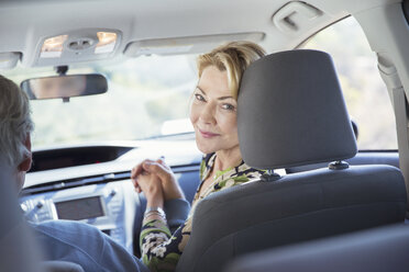 Portrait of smiling woman inside car - CAIF16936