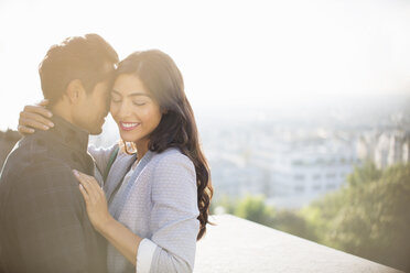 Couple hugging outdoors - CAIF17040