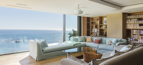 Living room overlooking ocean stock photo