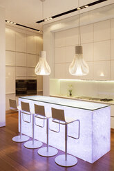 Bar stools and light features in modern kitchen - CAIF17161