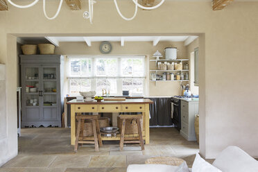 Island in kitchen of rustic house - CAIF17186