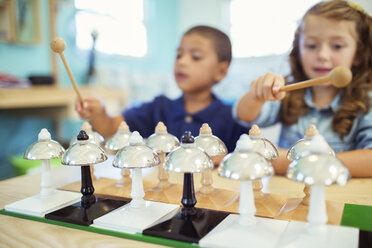 Students playing bells in class - CAIF17437