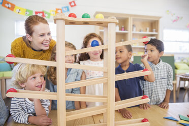 Students and teacher using model in classroom - CAIF17454