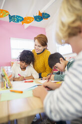 Students and teacher drawing in classroom - CAIF17478