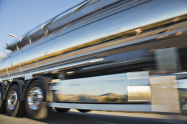 Blurred view of stainless steel milk tanker on the move - CAIF17573