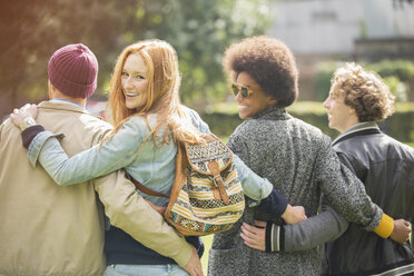 Friends walking together outdoors - CAIF17658