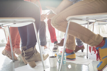 Close up of creative business people meeting in circle of chairs - CAIF17730