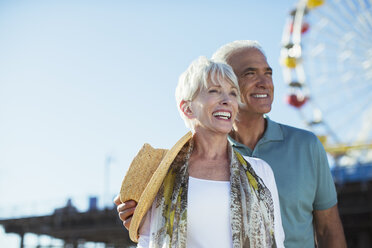 Happy senior couple at amusement park - CAIF17745