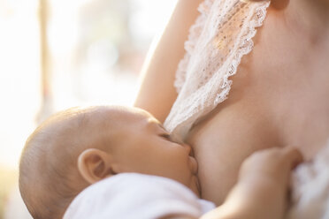 Mother breast-feeding baby boy - CAIF18207