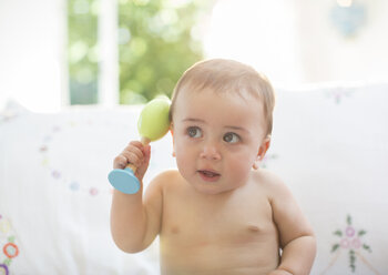 Baby boy playing with toy - CAIF18214