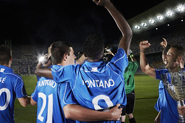 Soccer team cheering on field - CAIF18351