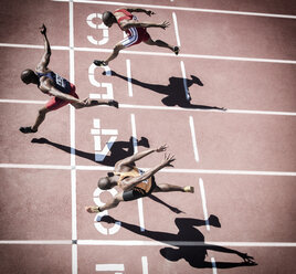 Runners crossing finish line on track - CAIF18490