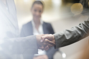 Close up of business people handshaking - CAIF18638