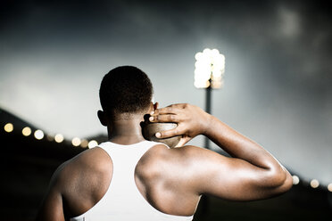 Track and field athlete holding shot put - CAIF18686