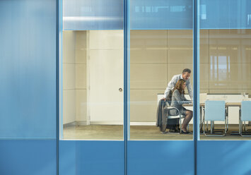 Business people talking in conference room - CAIF18706