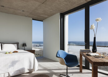 Modern bedroom overlooking ocean - CAIF18808