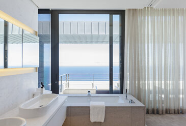 Modern bathroom overlooking ocean - CAIF18962