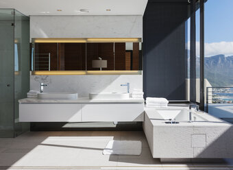 Sinks and bathtub in modern bathroom - CAIF18970