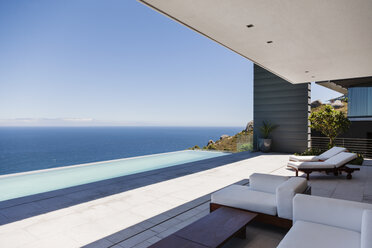 Modern patio overlooking ocean - CAIF18992