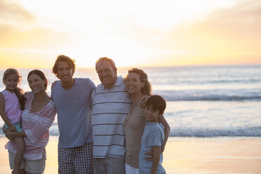 Family smiling together on beach - CAIF19149