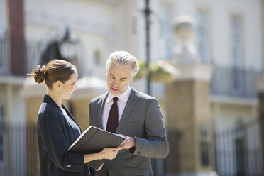 Business people talking outdoors - CAIF19223