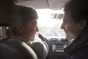 Close-up of couple sitting in car - CAVF09633