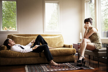 Unhappy couple in living room - CAVF09994
